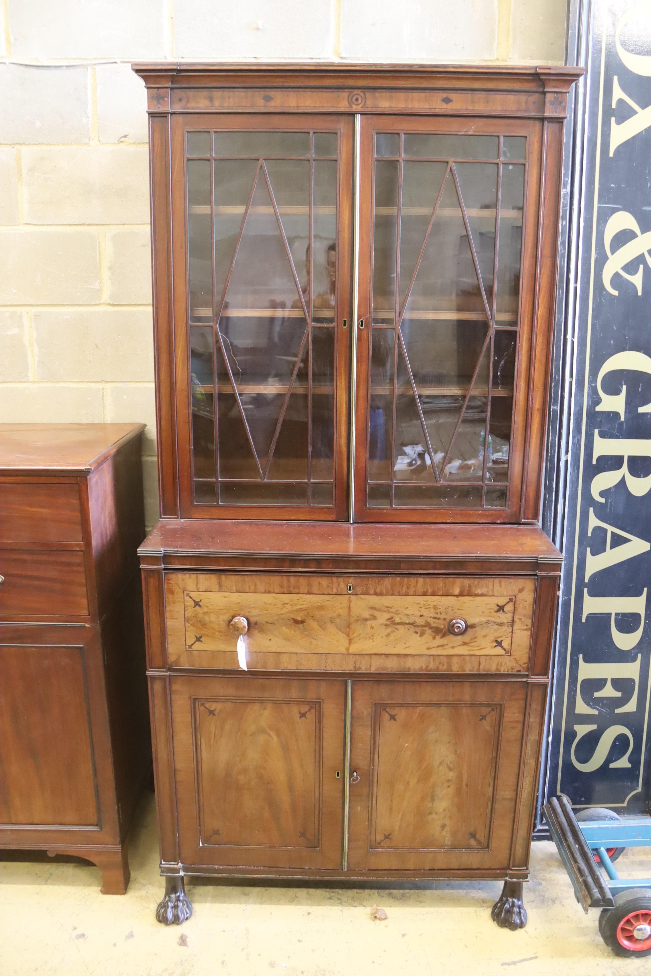 A Regency mahogany secretaire bookcase on lion paws feet, length 100cm, depth 56cm, height 216cm